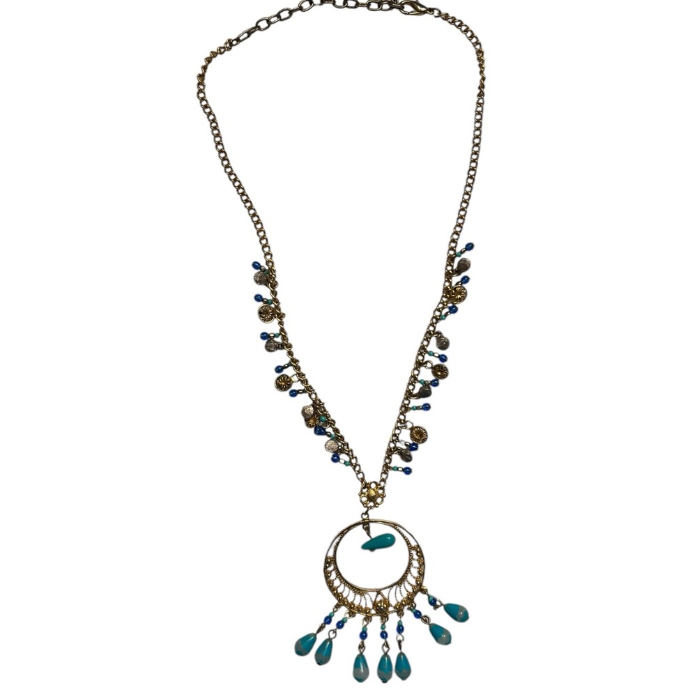Robert Rose gold colored necklace‎ with blue beads and gold colored pendant.